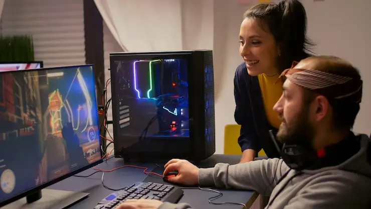 Mobile Game Development Agency in Canada pro gamer couple playing video games with RGB equipment