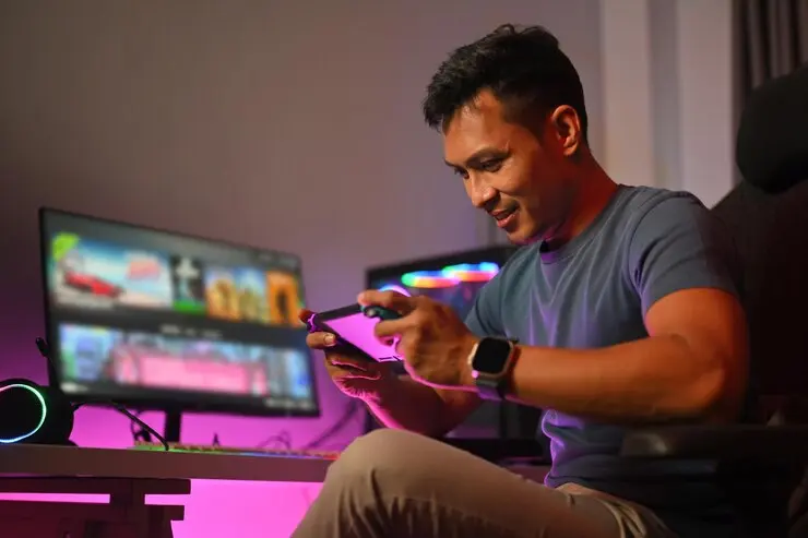 Mobile Game Development Agency in Canada gamer enjoying mobile game with neon lights